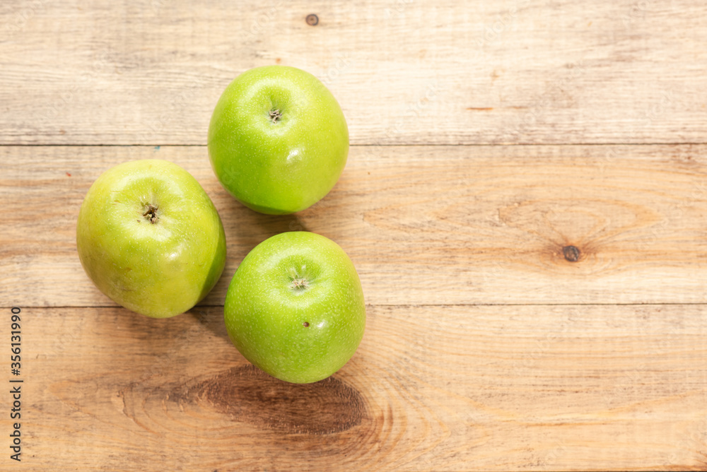 Ripe tasty apples on a wooden table. Healthy food Ripe tasty apples on a wooden table. Healthy food