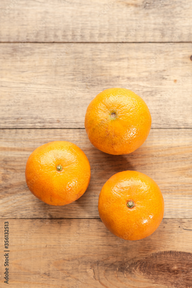 Ripe tasty tangerines on a wooden table. Healthy food Ripe tasty tangerines on a wooden table. Healthy food