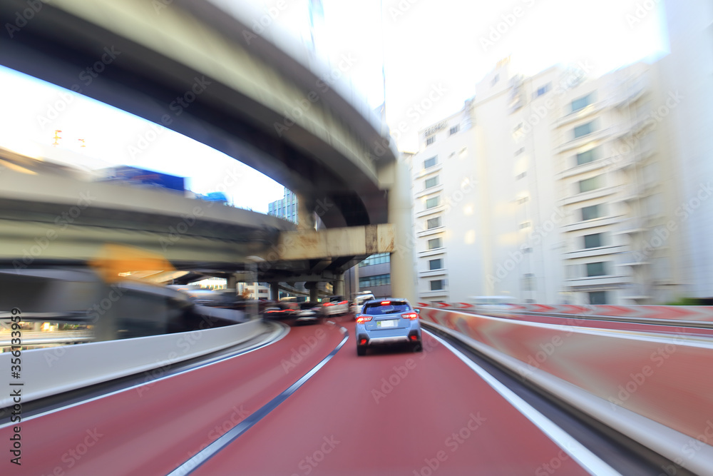 car driving on highway in central Tokyo