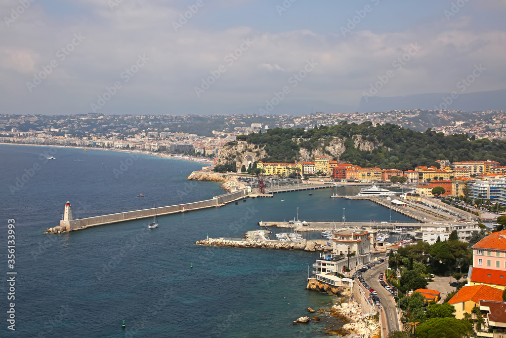 Beautiful view of Nice harbor from Mont Boron. Also you can see the Promenade des Anglais, the marina, buildings and the Mediterranean Sea, Nice, French Riviera, Provence, Côte d'Azur, France.