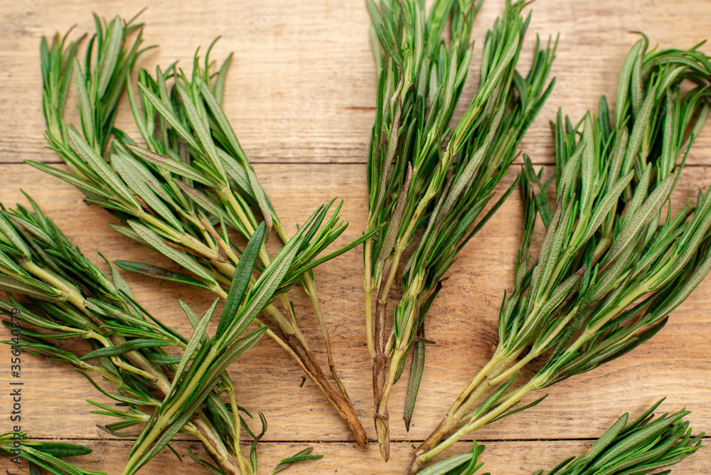 Tasty and aromatic rosemary on a wooden table. Healthy food Tasty and aromatic rosemary on a wooden table. Healthy food