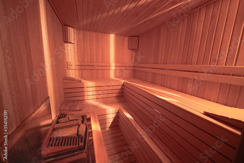 sauna bathhouse warm interior inside empty brooms barrels bucket for water,Interior of Finnish sauna, classic wooden sauna © Erkan