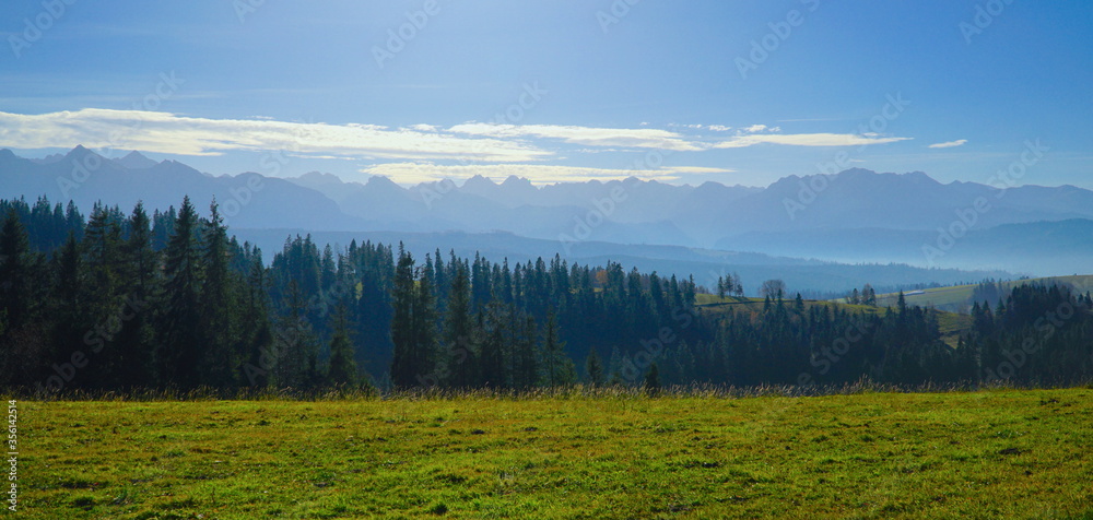 Tatra mountains and strony path in autumn, Poland. The Tatra Mountains, part of the Carpathian mountain chain in eastern Europe, create a natural border between Slovakia and Poland. Tatra mountains and strony path in autumn, Poland. The Tatra Mountains, part of the Carpathian mountain chain in eastern Europe, create a natural border between Slovakia and Poland.