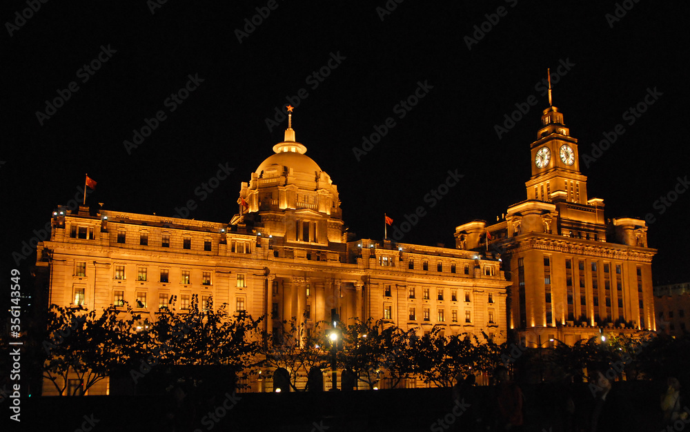 The Bund in Shanghai, China. The Bund is a riverfront area in central Shanghai with many historic concession era buildings. The illuminations on the Bund at night are popular with tourists in Shanghai