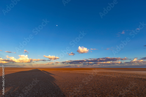 Photography Long shadows on Verneukpan and clouds on the horizon