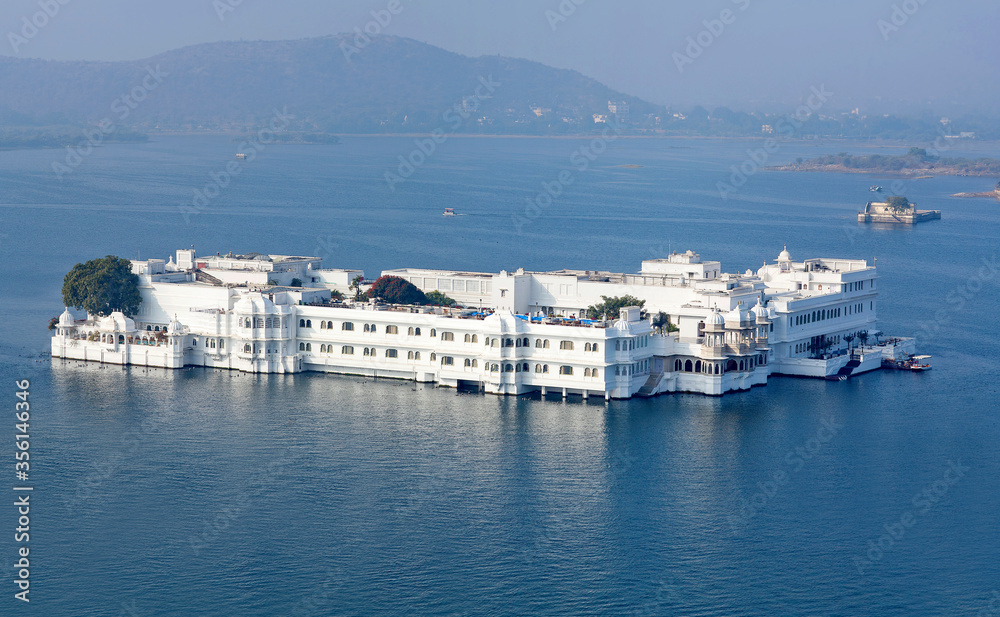 Panoramic aerial view of Taj Lake Palace in Udaipur, Rajasthan state, India. It was built between 1743 and 1746 on the island of Jag Niwas in Lake Pichola for the royal dynasty of Mewar.