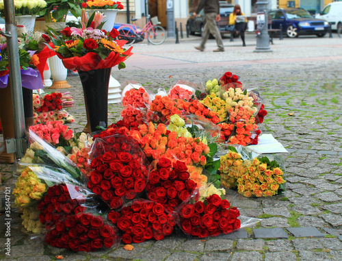 Beautiful bright bouquets of roses on the street for sale. Wroclaw, Poland.