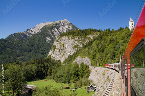 Obraz na płótnie View out of the ÖBB Train window in the Austrian alps with Interrail ticket