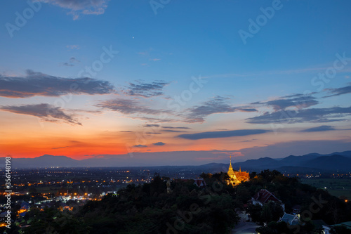 Sunset At Wat Phrathat Doi Saket Chiangmai City Thailand. © Nattawat