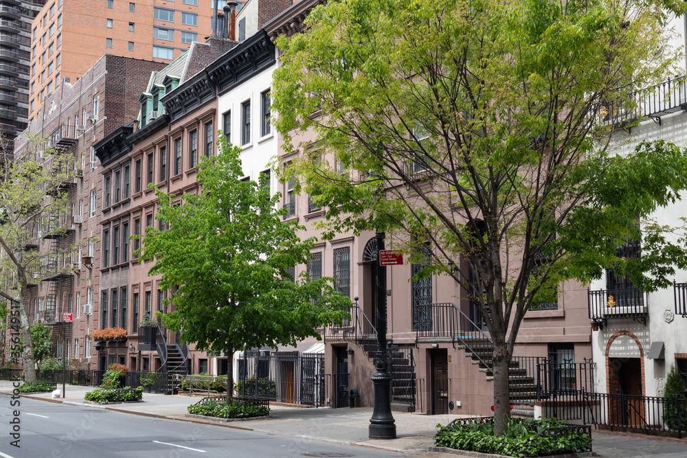 Row of Beautiful Old and Fancy Townhouses along an Empty Street on the Upper East Side of New York City