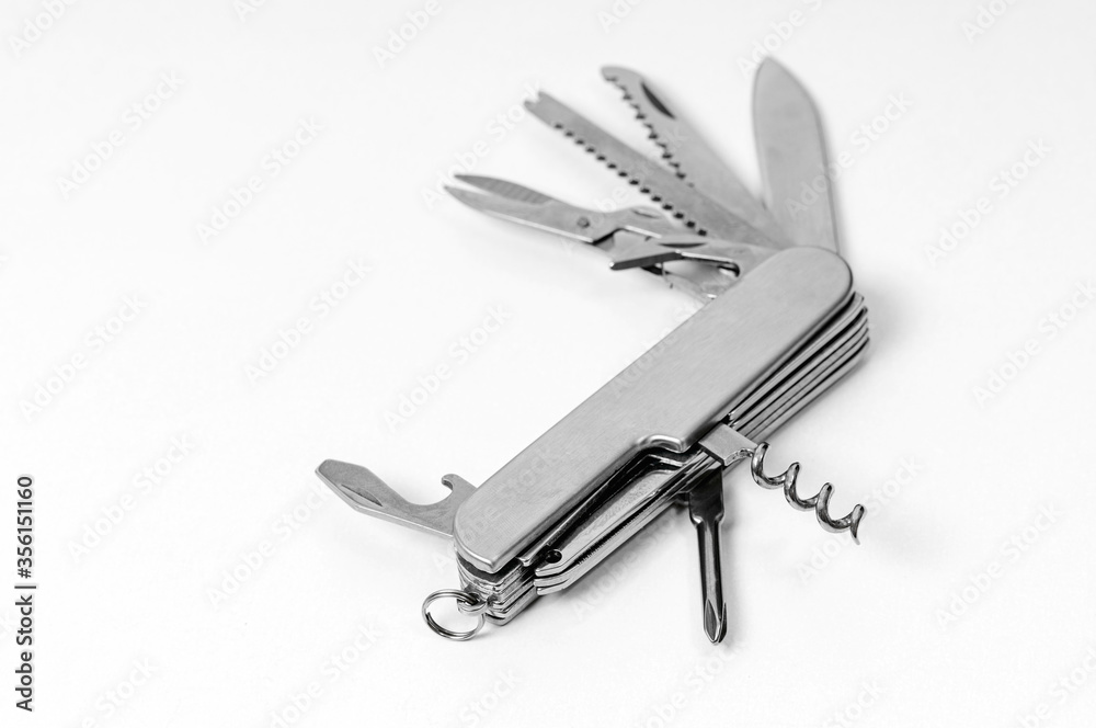 multi-function knife on white background close-up, mock-up, blank for your design multi-function knife on white background close-up, mock-up, blank for your design