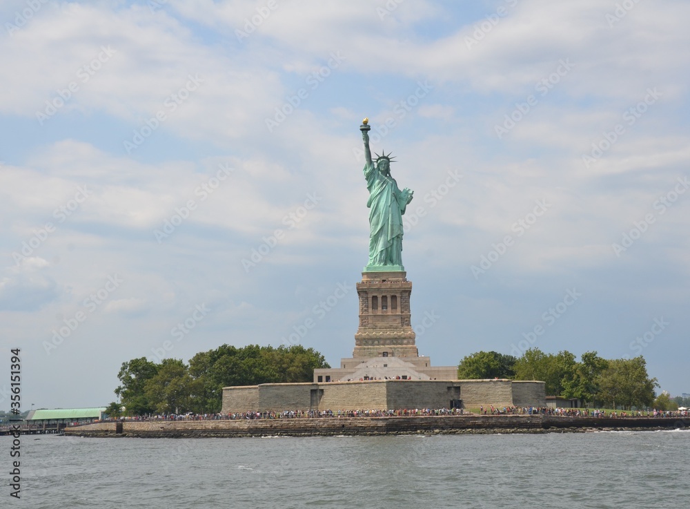 statue of liberty on an island from the water