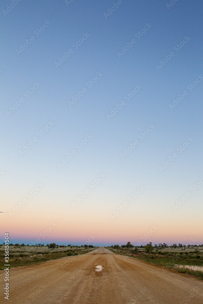 Sunrise over dirt road in the Pilbara