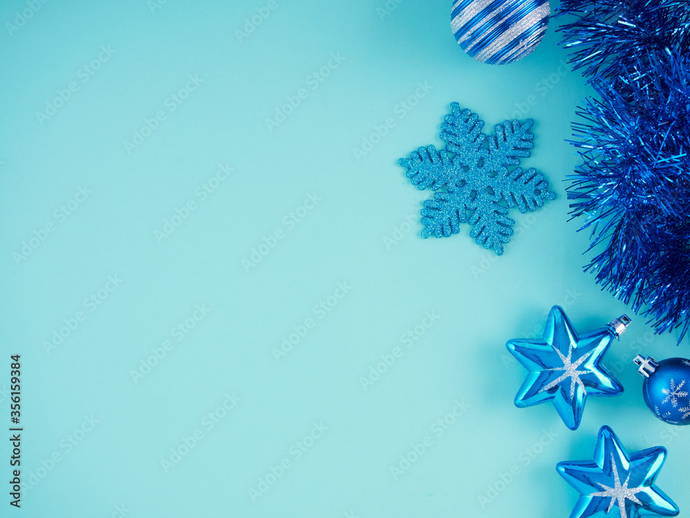 Fototapeta premium Christmas decorations on light blue background.