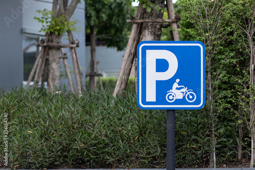 Blue Sign Board of Bicycle and Motorcycle parking. Blue and white Symbol designating motorcycle parking.