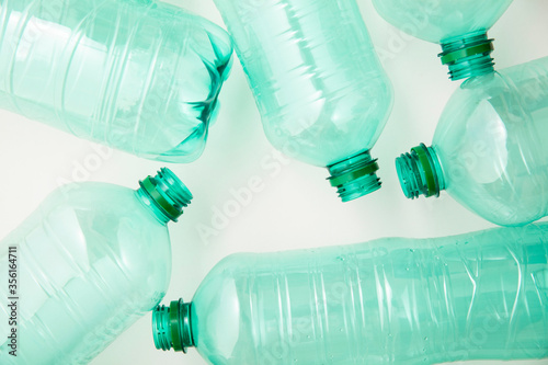 Empty used green plastic water bottles for recycling. environment concept