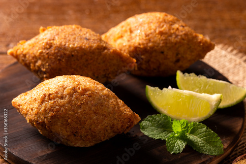 Potato Kibbeh - Middle Eastern minced meat and bulghur wheat fried snack made with potato. Also popular party dish in Brazil (kibe). photo