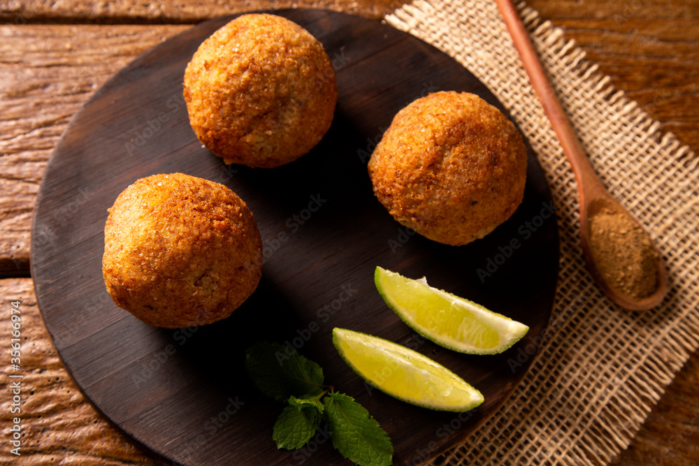 Potato Kibbeh - Middle Eastern minced dry curd wheat fried snack made with potato. Also popular party dish in Brazil (kibe) Potato Kibbeh - Middle Eastern minced dry curd wheat fried snack made with potato. Also popular party dish in Brazil (kibe)