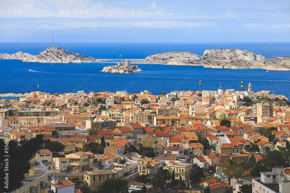 Aerial panoramic view of Marseille city with sailing boats on mediterranean sea in summer.