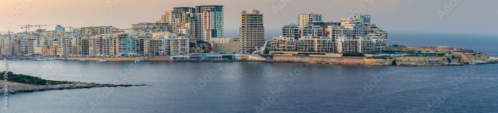 Malta. Panoramic view of the city and the bay at sunset. Malta. Panoramic view of the city and the bay at sunset.