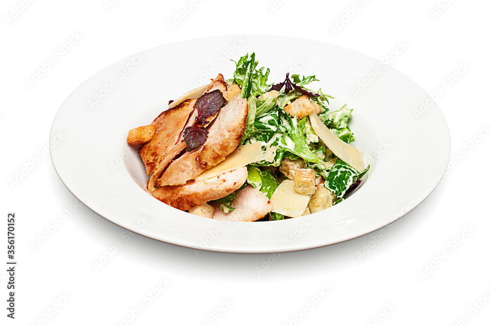 Caesar Salad with Chicken Fillet and Parmesan Cheese isolated on white background Caesar Salad with Chicken Fillet and Parmesan Cheese isolated on white background