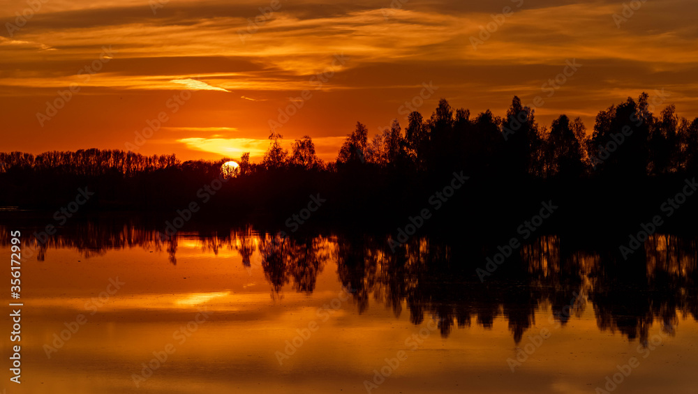 Beautiful sunset with reflections at Ettling, Isar, Bavaria, Germany