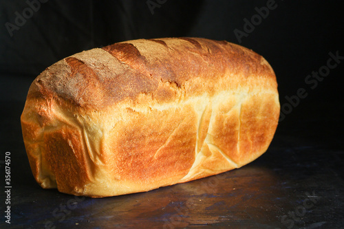 bread white golden fresh wheat baking. food background top view copy space for text