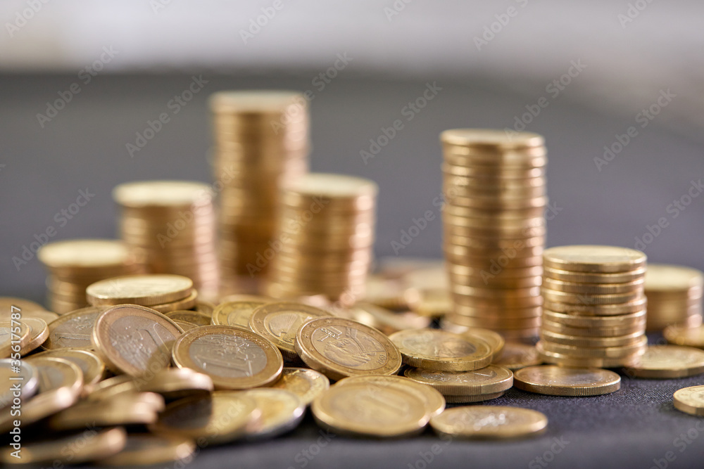 Stock Photo - Euro coins. Euro money. Euro currency.Coins stacked on each other in different positions. Money concept Stock Photo - Euro coins. Euro money. Euro currency.Coins stacked on each other in different positions. Money concept