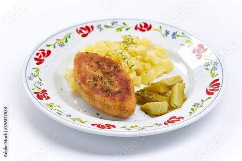cutlet with mashed potato on white plate