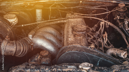 Picture of engine of car. Close up details of an old car engine room is dirty and rust chemical reaction.