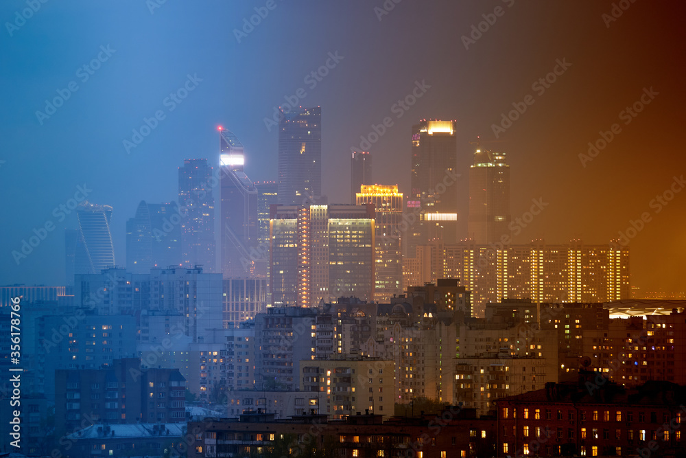 Fototapeta premium Time-lapse collage of slices of different times. Lighting of the city at different times of the day. Business Center Moscow City. Moscow. Russia. 