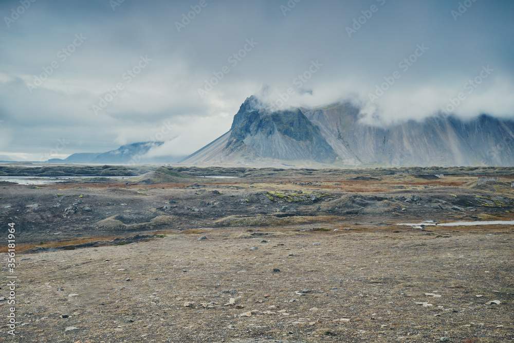 Autumn rainy day. Mountains in clouds. Stokksnes, Iceland.