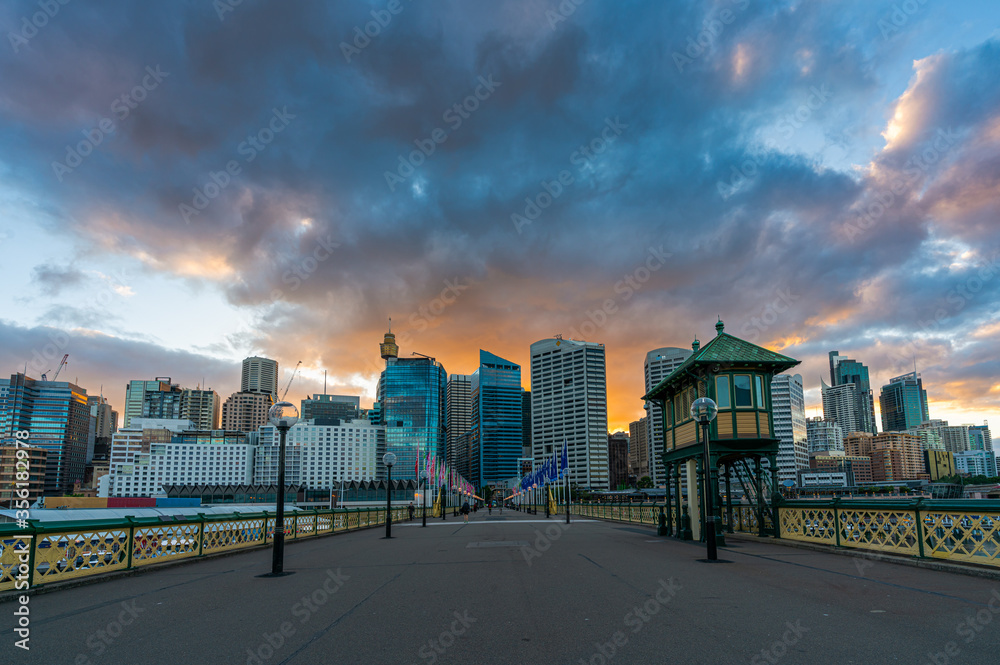 Sydney downtown skyline at Darling Harbor bay, business and recreational arcade, in Sydney, NSW, Australia at sunrise Sydney downtown skyline at Darling Harbor bay, business and recreational arcade, in Sydney, NSW, Australia at sunrise