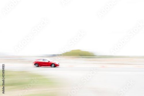 red car going fast