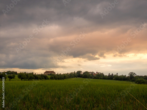 sunset in the field  sunset with dramatic clouds  landscape in Czech Republic