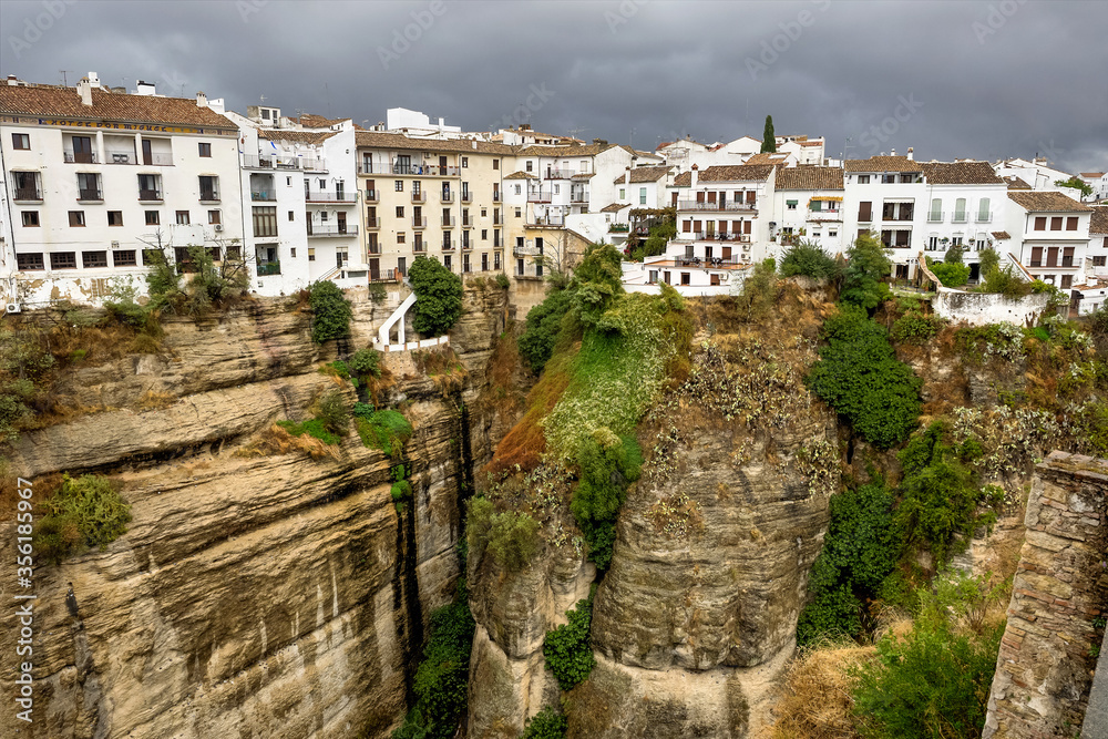 Scenic sight of Ronda with white houses built on high cliffs, Andalusia, Spain.