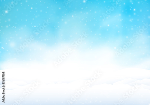Snowstorm with blue sky. Winter background with snow banks in the snowfall. © GraffiTimi