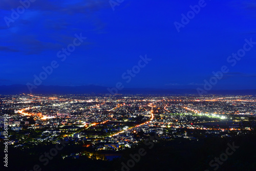 Photograph of Chiang Mai city in evening time with twilight and blue sky © Wiradej