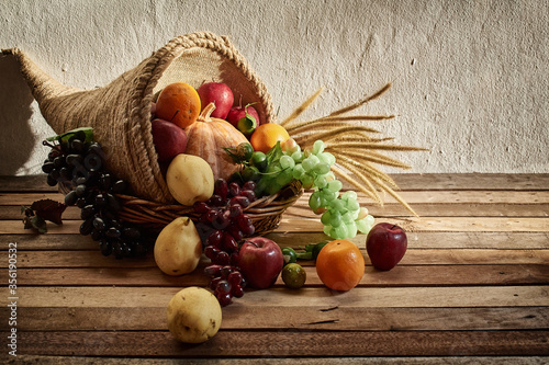 Photos Thanksgiving cornucopia filled with pumpkins and fruit decorated with flower aga