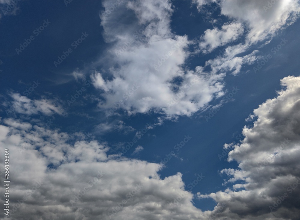 Fototapeta premium Blue sky with white-gray thunderclouds. Kishinev. Moldova.