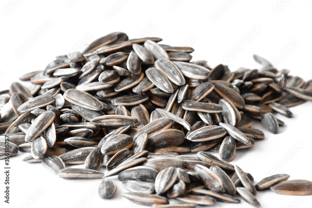 A pile of dried sunflower seeds. A pile of dried sunflower seeds.
