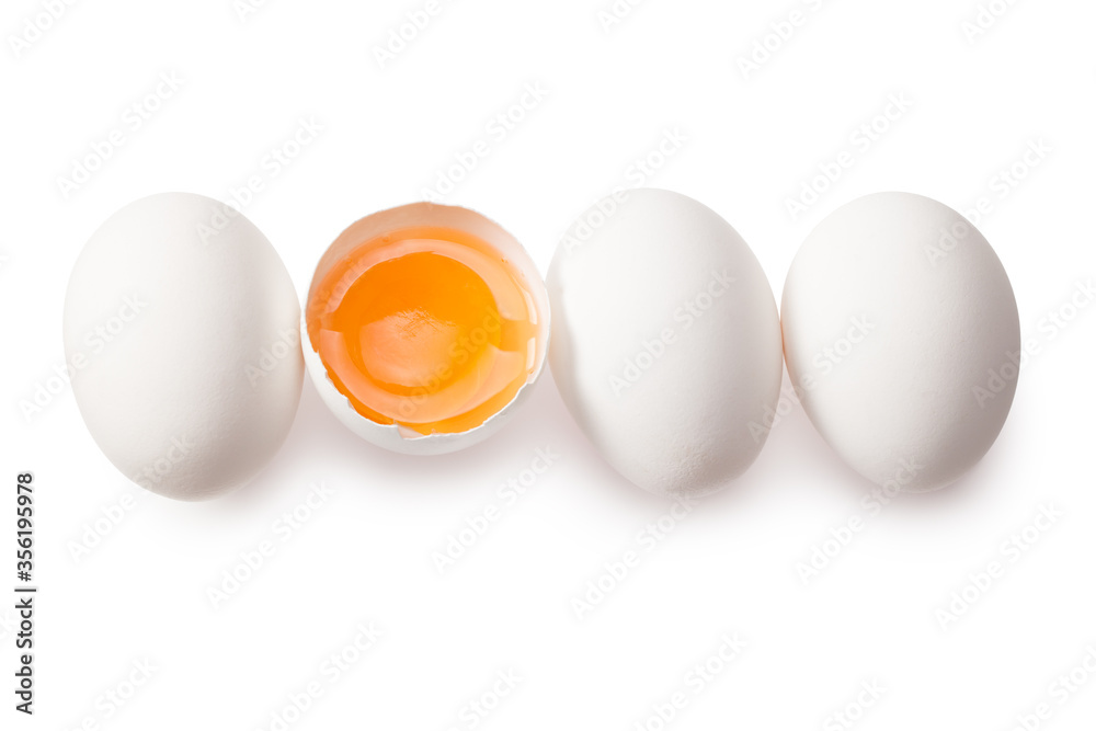 Chicken egg is half broken among other eggs isolated on white background. Top view Chicken egg is half broken among other eggs isolated on white background. Top view