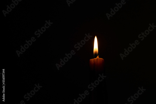 One candlelight lit in the dark