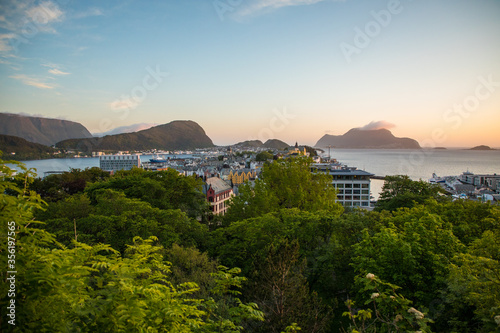 Gdansk, Poland - Juny, 2019: Alesund is a port and tourist city at the entrance to the Geirangerfjord. Cityscape image of Alesund at dawn.