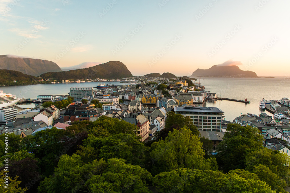 Gdansk, Poland - Juny, 2019: Alesund is a port and tourist city at the entrance to the Geirangerfjord. Cityscape image of Alesund at dawn.