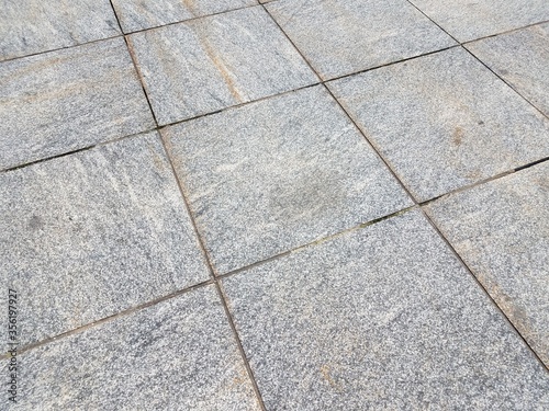 grey square floor tiles on the ground or background