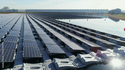 WS POV Pond with floating solar farm supporting greenhouses / Bemmel, Gelderland, Netherlands photo