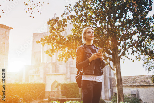 Photography Young attractive woman with good mood enjoying beautiful city landscape