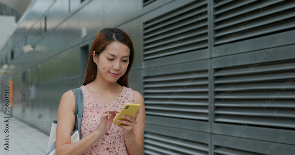 Woman work on mobile phone at outdoor Woman work on mobile phone at outdoor
