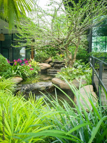 small waterfall and green plant home and gardening